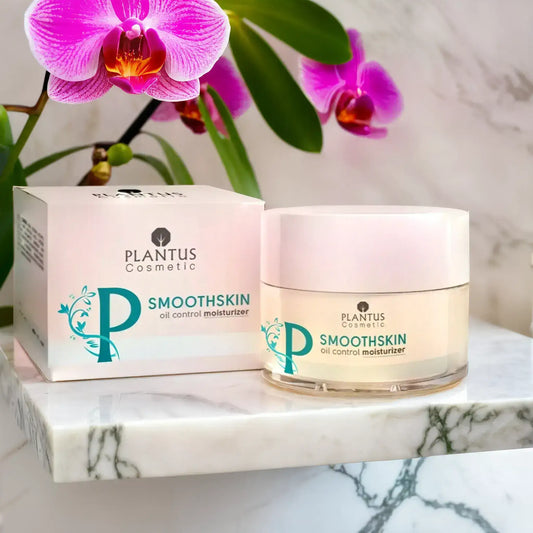 Best skincare tips: Plantus Smoothskin oil control moisturizer on a marble surface with an orchid.