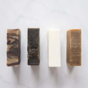 Rose Sponge Soap collection featuring four handmade bars showcasing natural colors and textures.