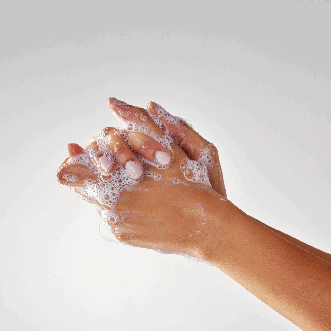 Hands lathering Miara Essence Camel Milk Soap UAE, showcasing its rich, moisturizing foam.