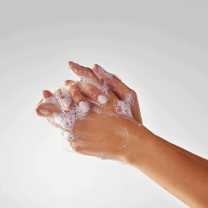 Hands lathering Miara Essence Camel Milk Soap UAE, showcasing its rich, moisturizing foam.