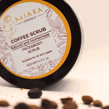 Natural Coffee Scrub by Miara Essence in a jar with coffee grounds, perfect for face and body rejuvenation.