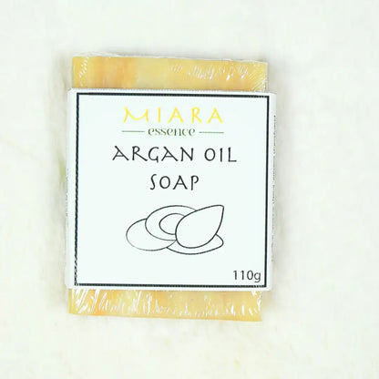 Miara Essence Argan Oil Natural Soap bar with packaging displaying its name and weight for glowing skin.