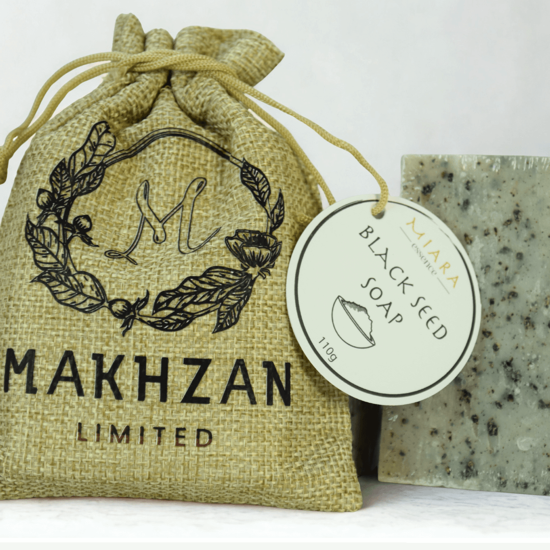Black Seed Natural Soap by Miara Essence displayed with packaging in a natural burlap bag.