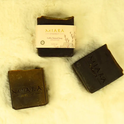Miara Essence Coffee Natural Soap bars displayed on a soft surface, showcasing natural ingredients and packaging.