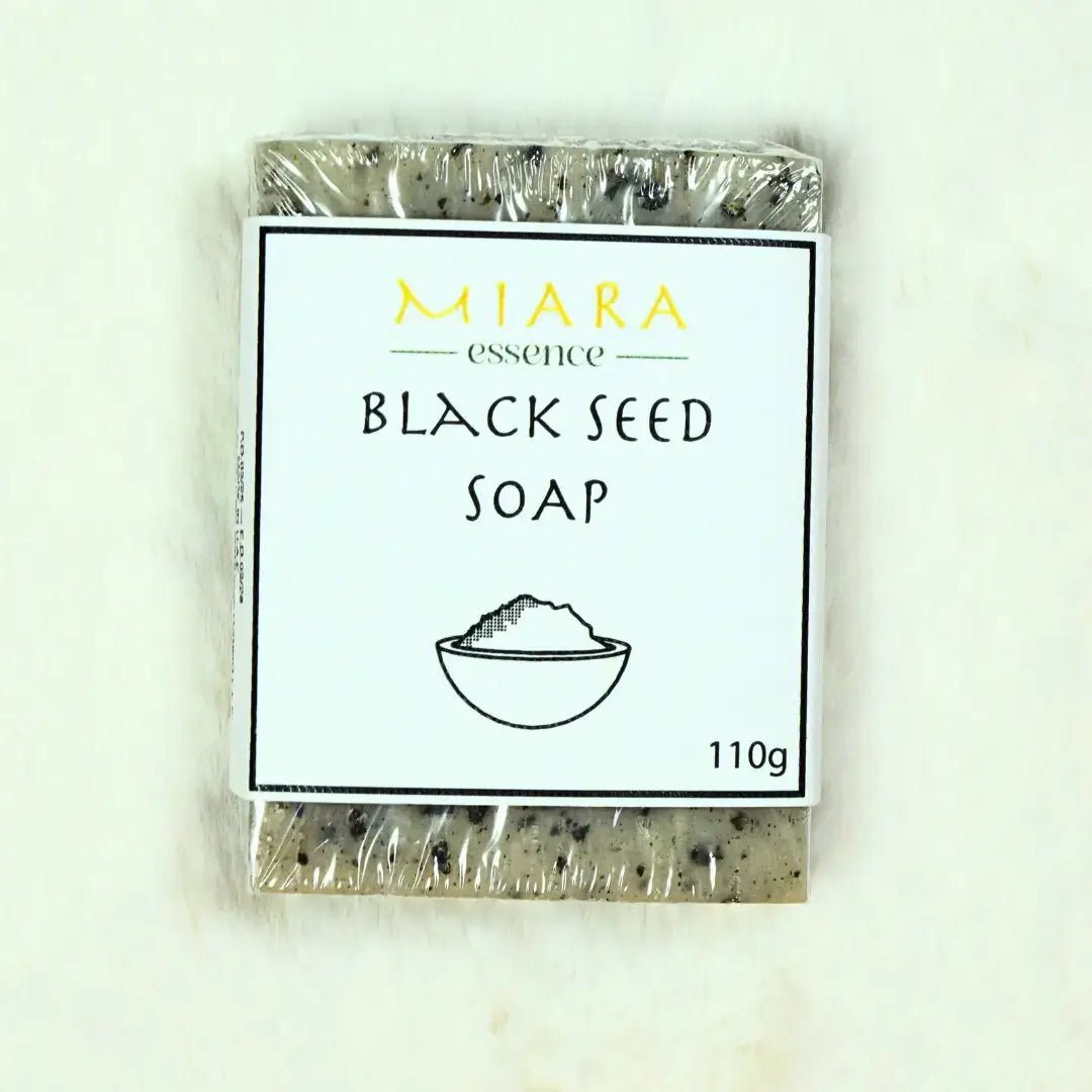 Miara Essence Black Seed Natural Soap bar wrapped in clear plastic, showcasing its earthy texture and branding.