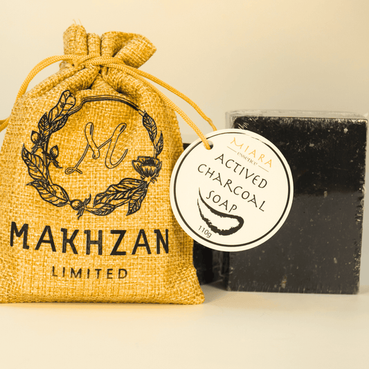Miara Essence Activated Charcoal Soap packaged in a burlap sack, promoting skin detox and cleansing benefits.