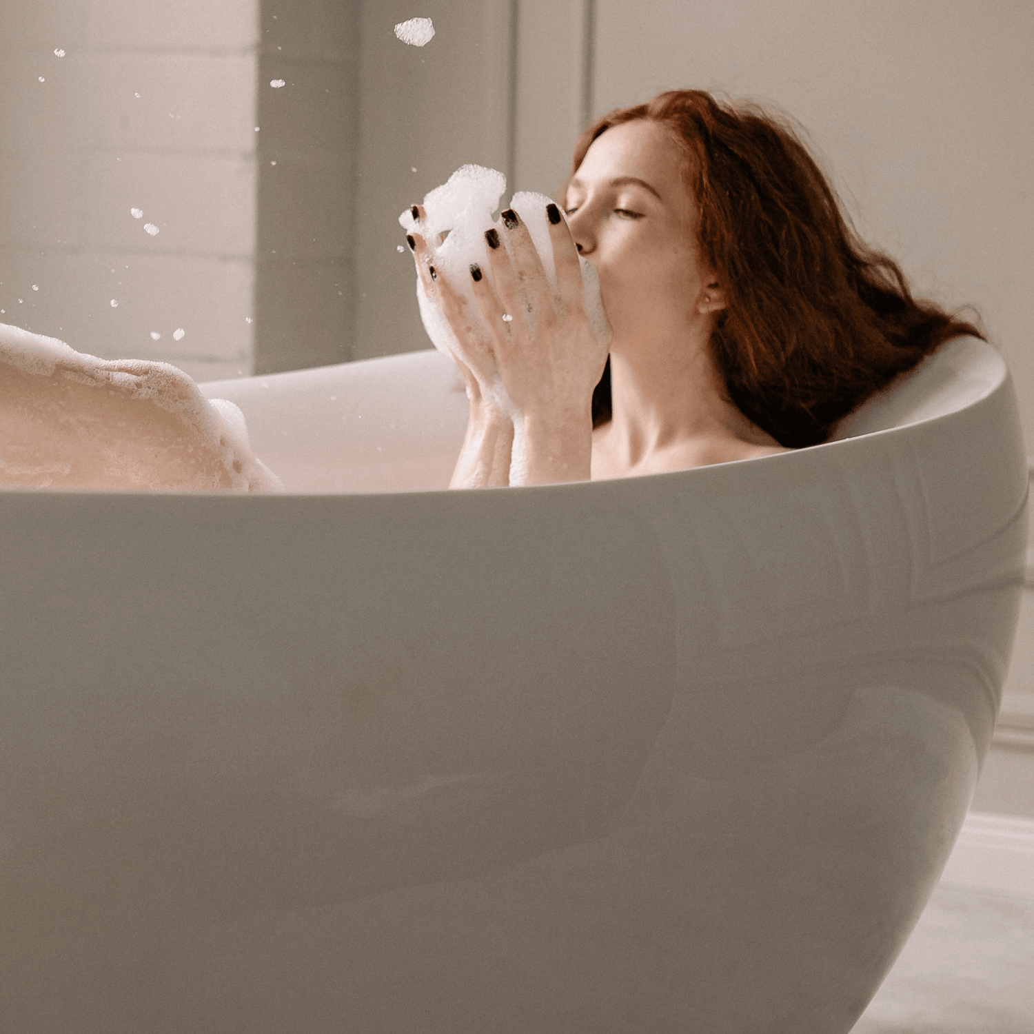 Lady having a spa like experience at home with Miara Essence natural soap with Curcuma longa